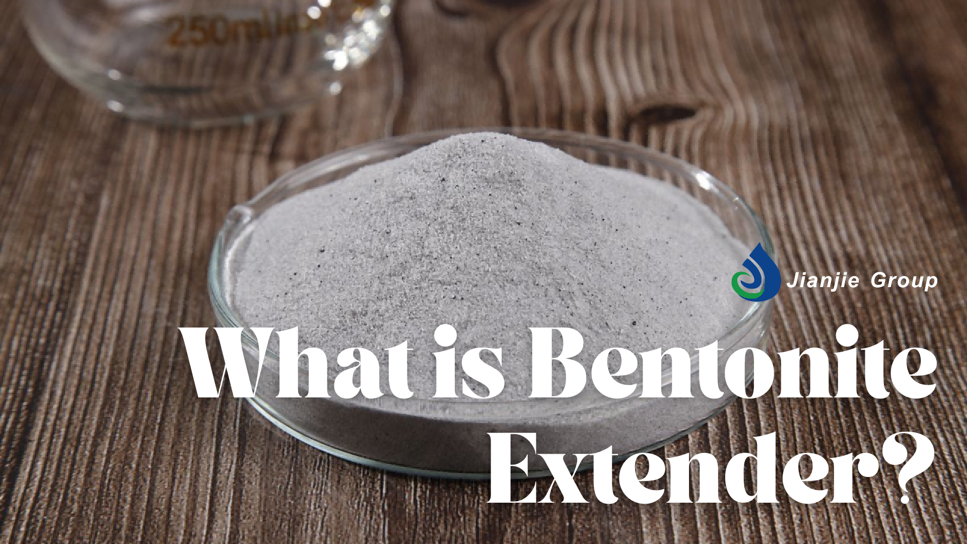 Image showing a petri dish filled with gray bentonite extender powder on a wooden surface, with the text "What is Bentonite Extender?" and the Jianjie Group logo.