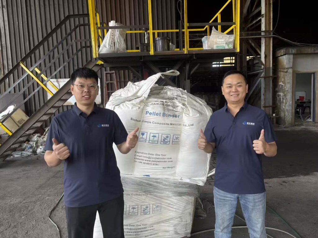 jianjie engineers standing in front of jianjie binder ton bag