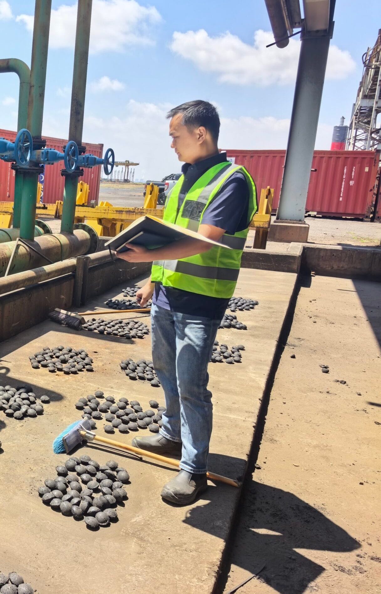 steel mill briquettes on belt conveyor